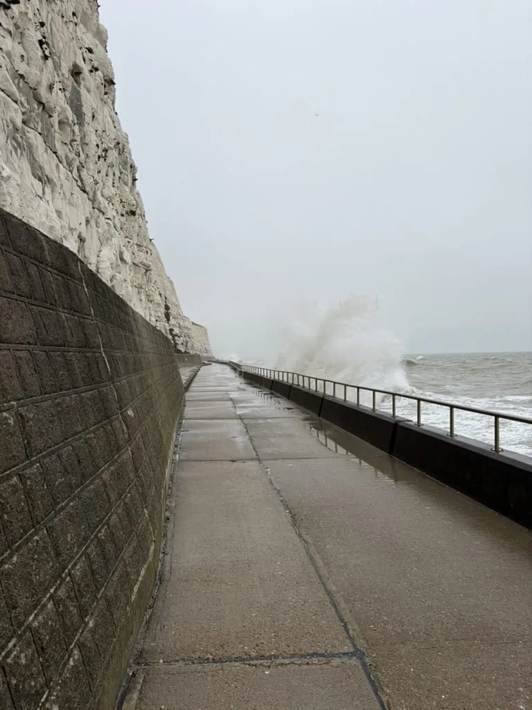 Waves breaking over the undercliff walk