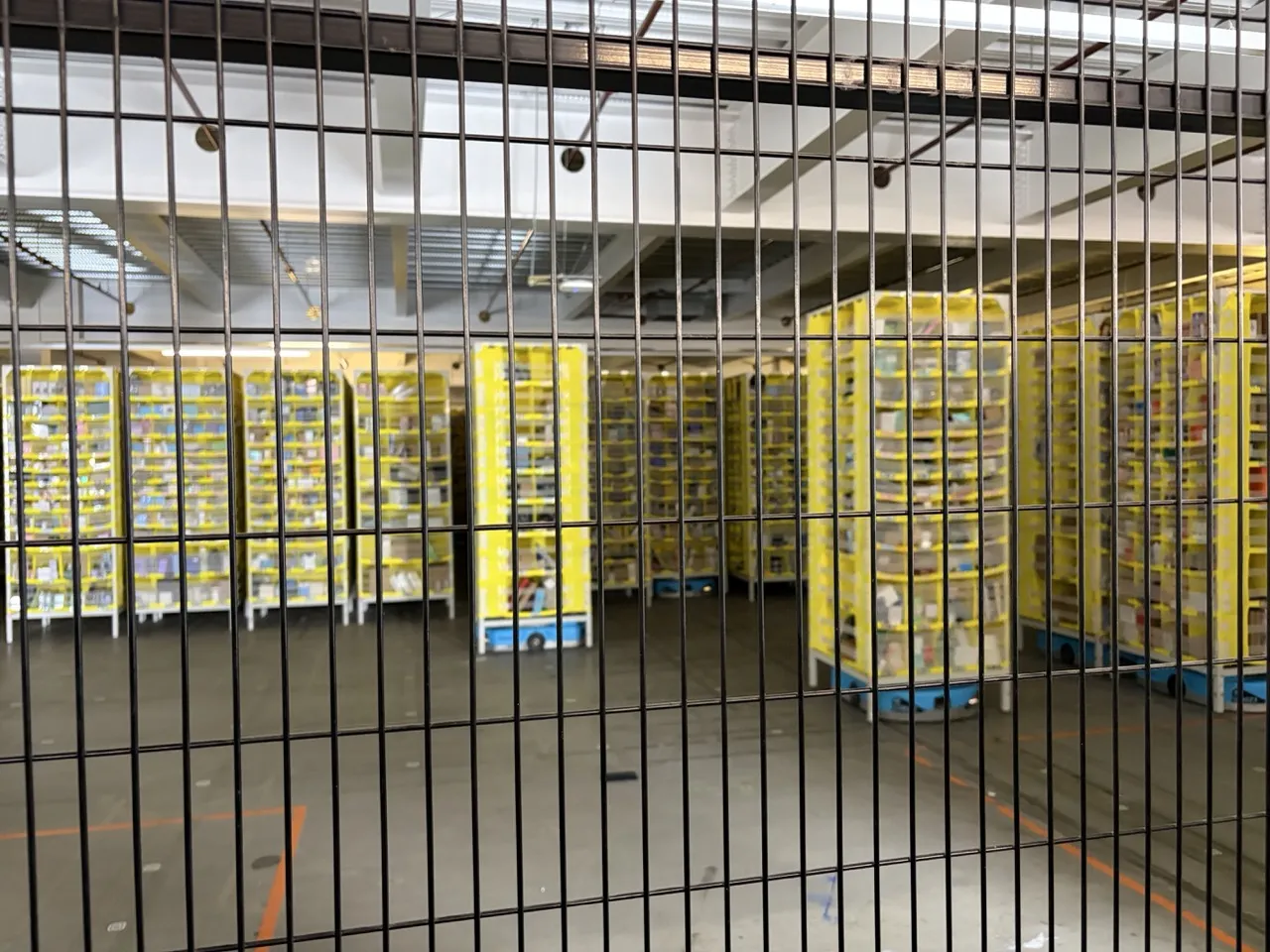 The Hercules robots carrying mobile shelves of stock